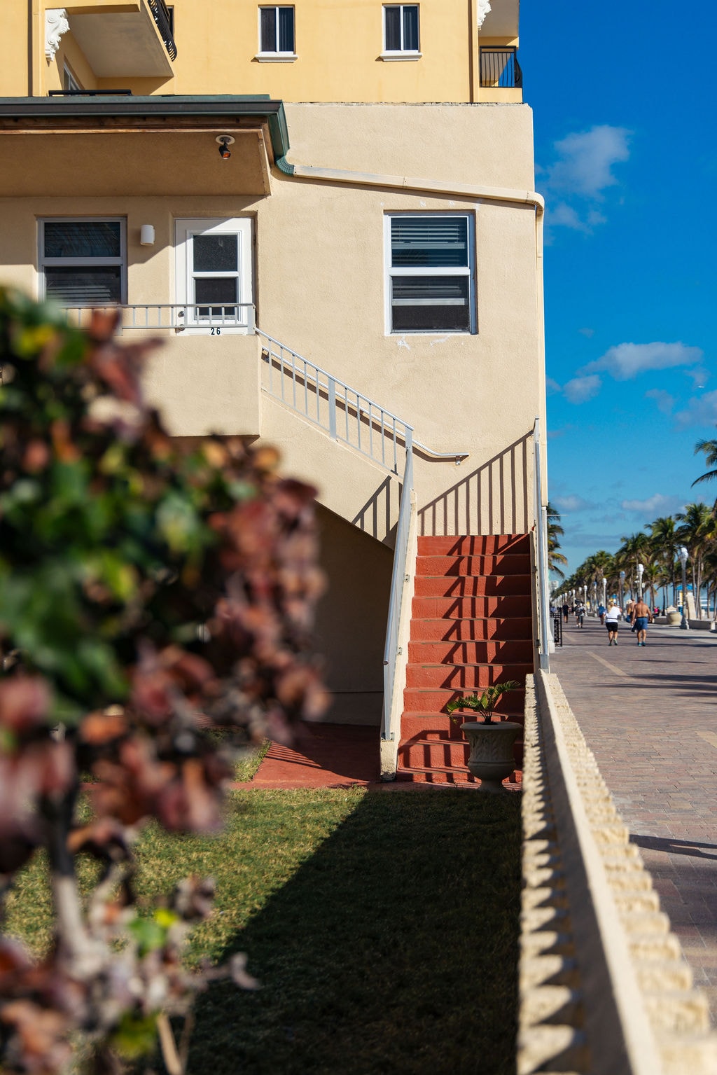 Bel-Aire Beach Apartments building exterior with Hollywood Beach boardwalk